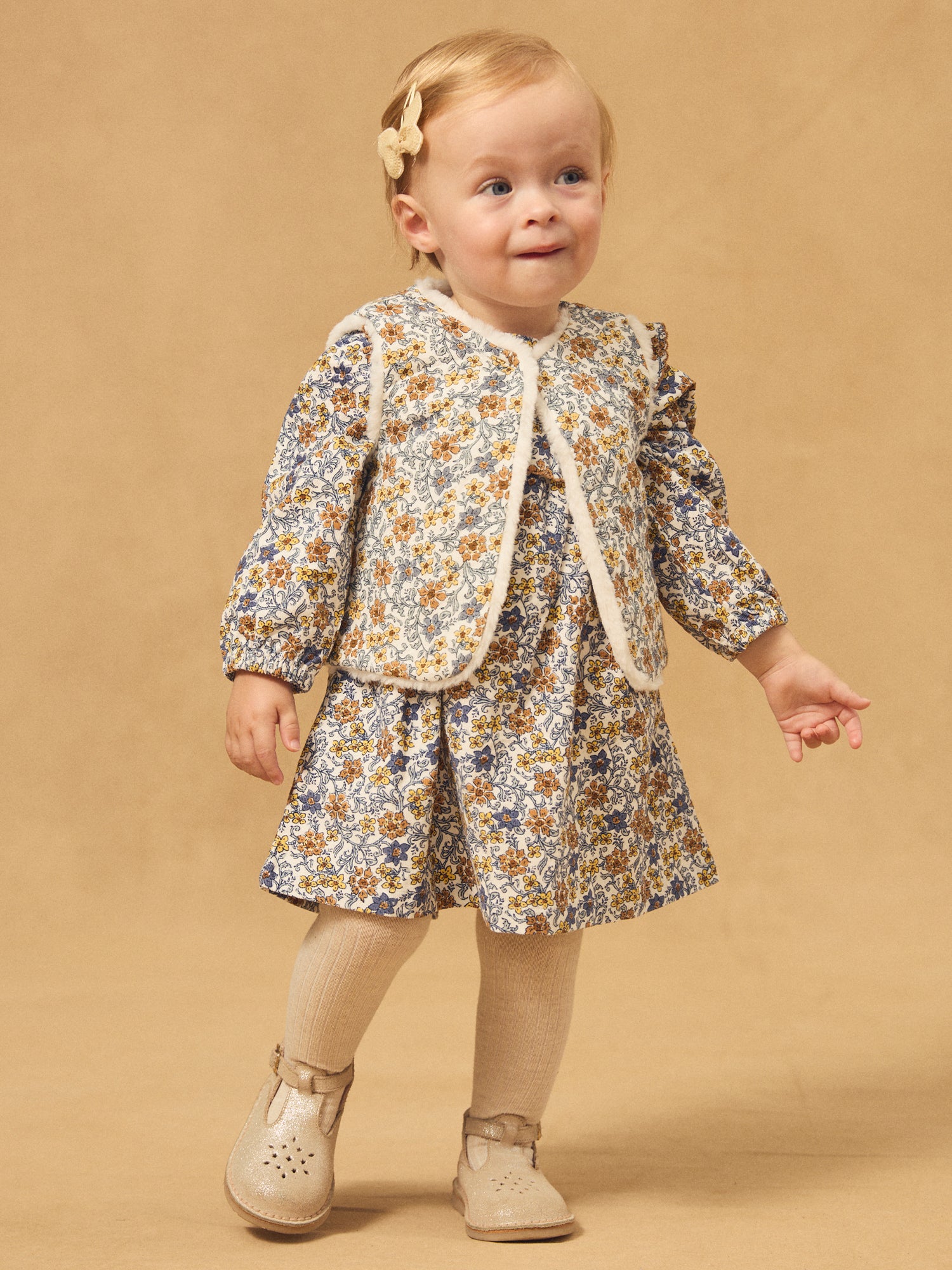 Gilet reversibile bianco in pelliccia o stampa floreale per bambina