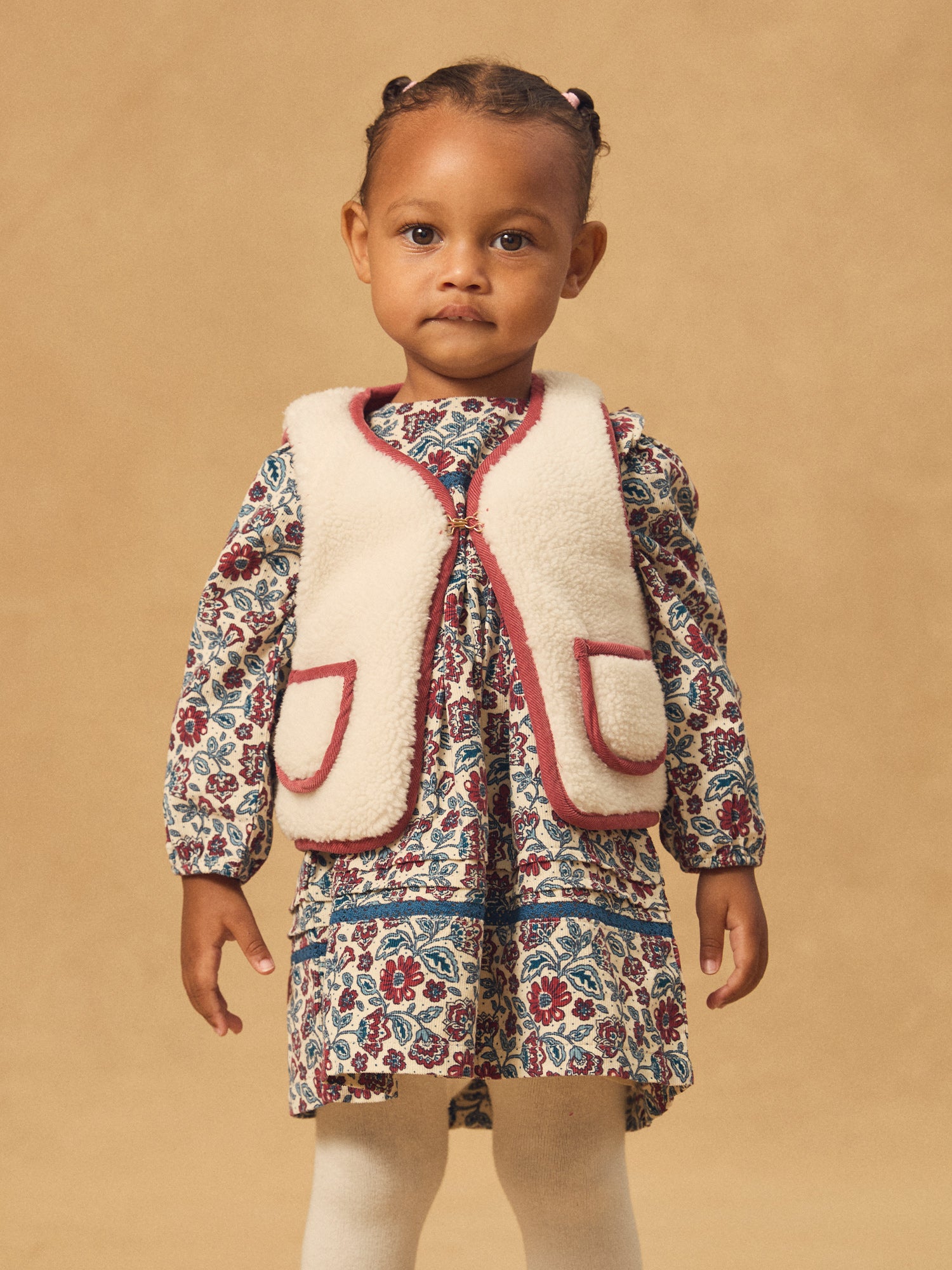 Cardigan senza maniche reversibile rosso o ecru per bambina