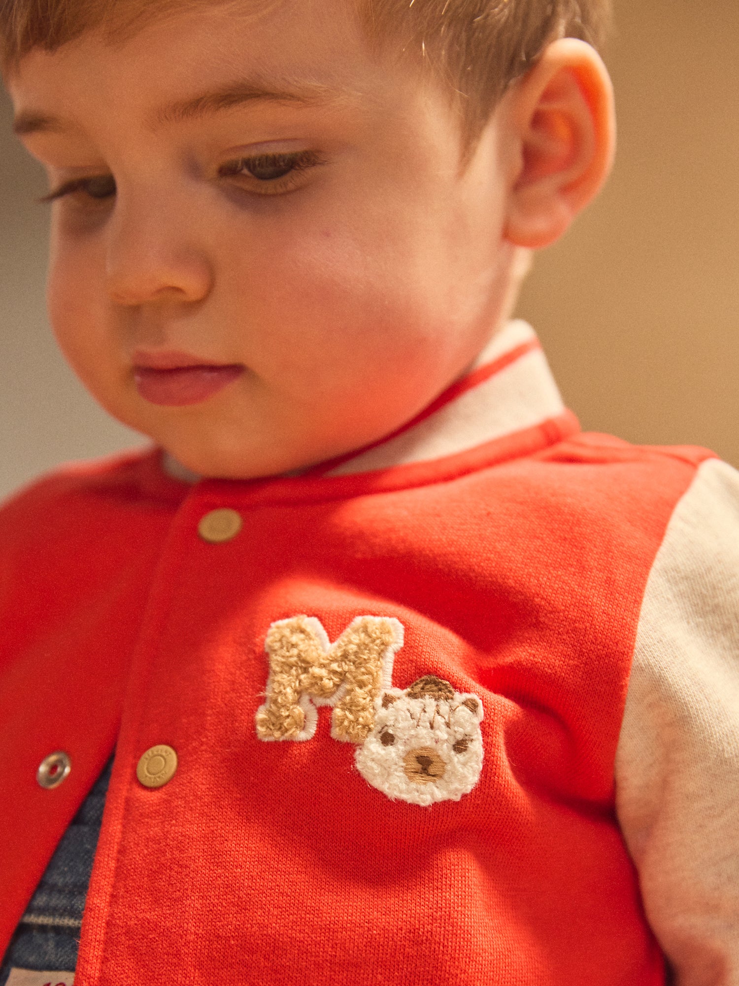 Giacca Teddy rossa e ecrù per bambino