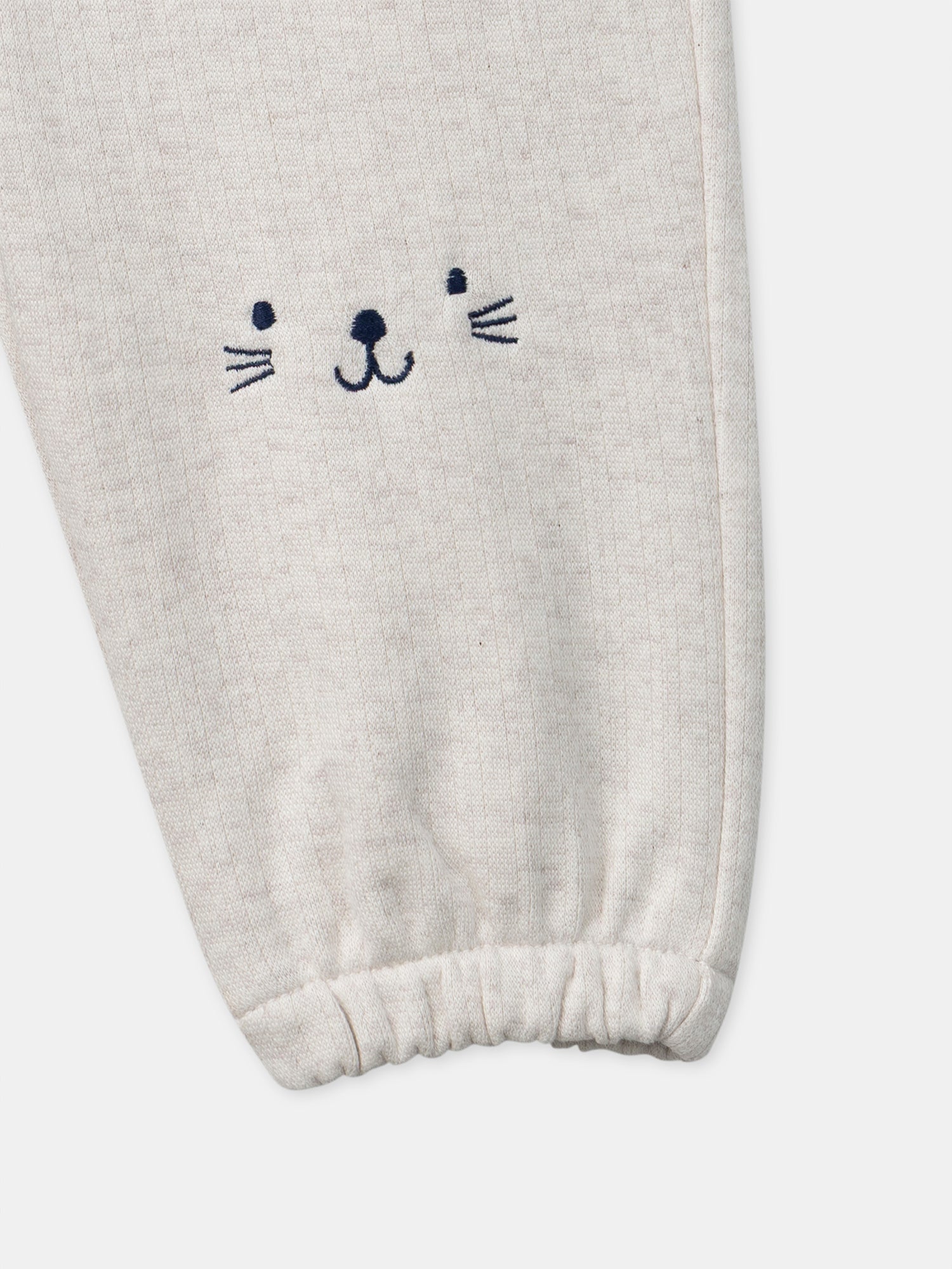 Pantaloni ecru con faccia di animale per bambino