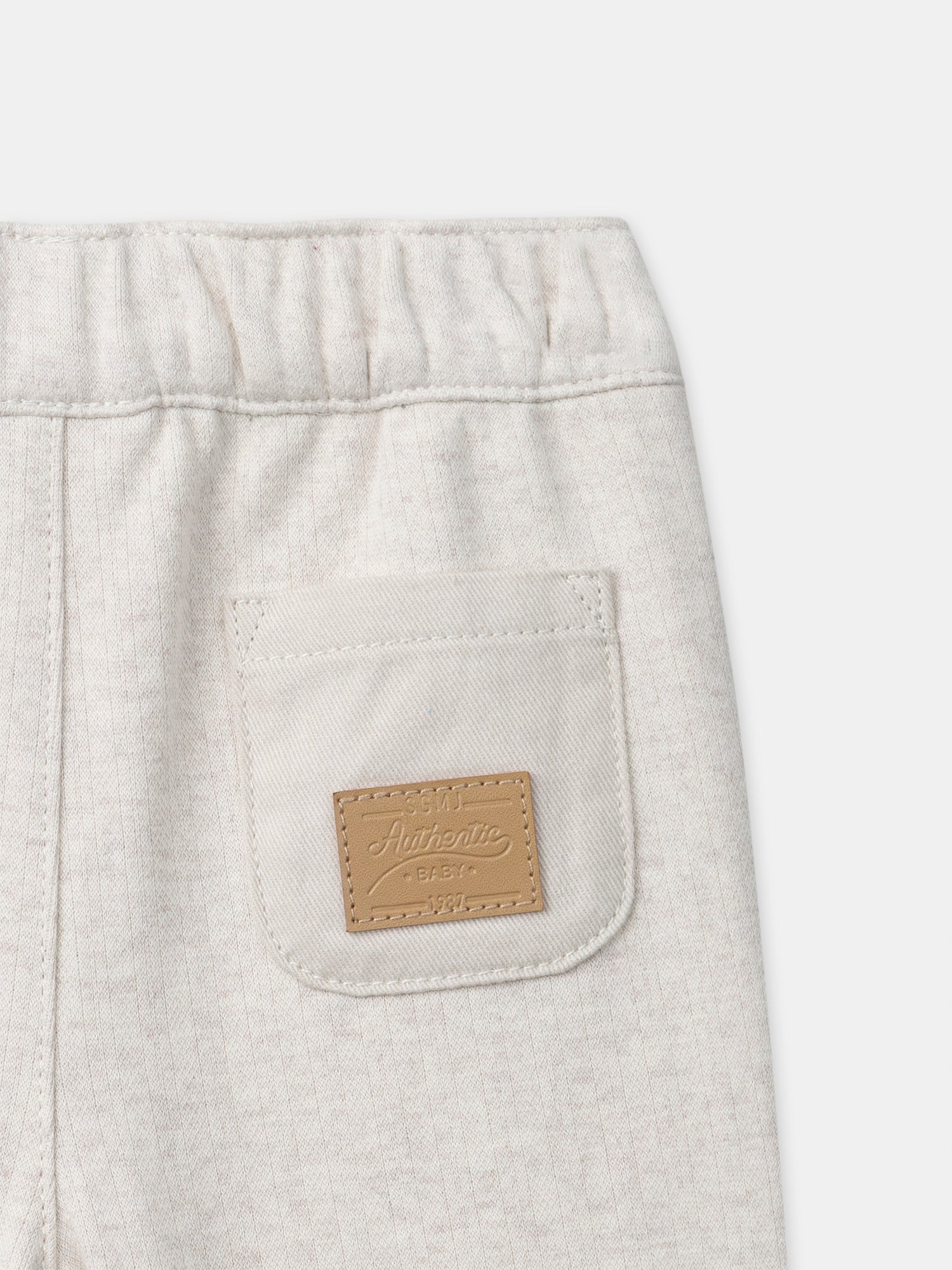 Pantaloni ecru con faccia di animale per bambino