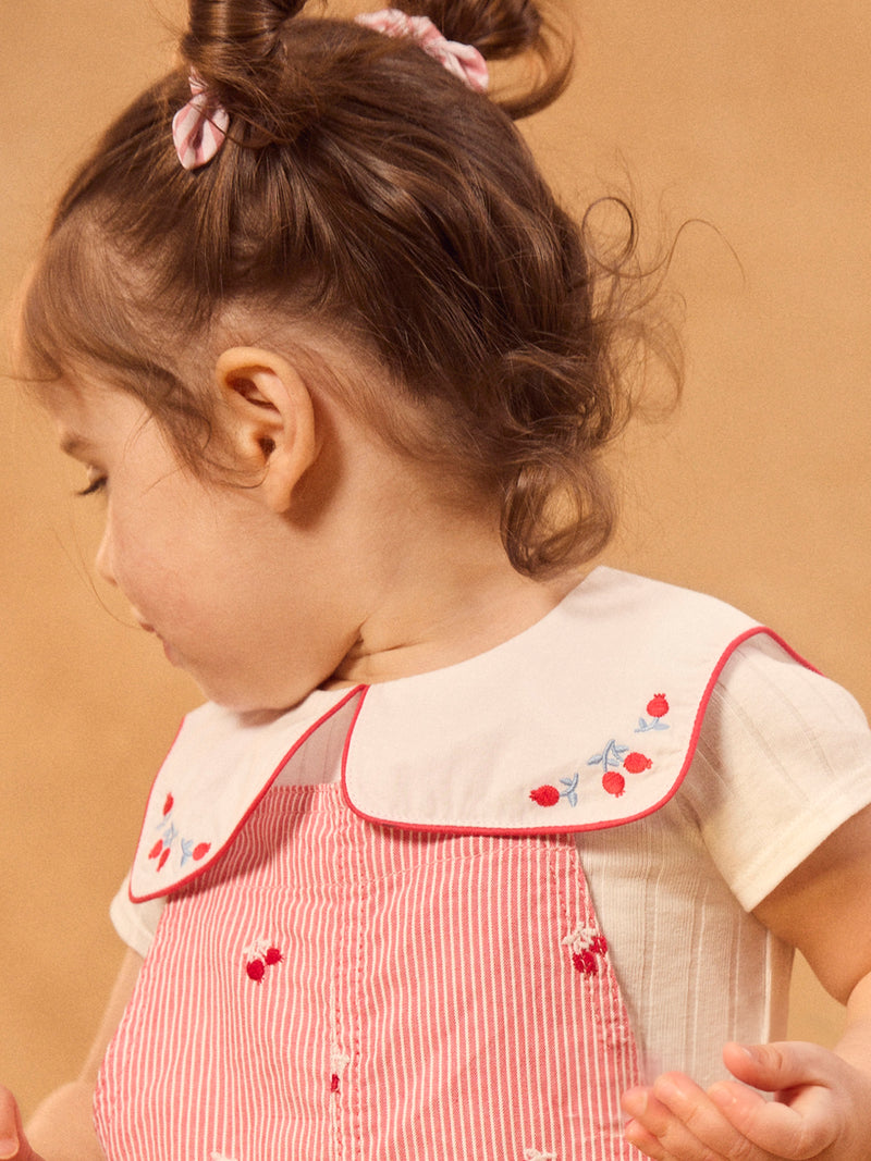 Salopette a righe rosse con ricami di bacche per bambine
