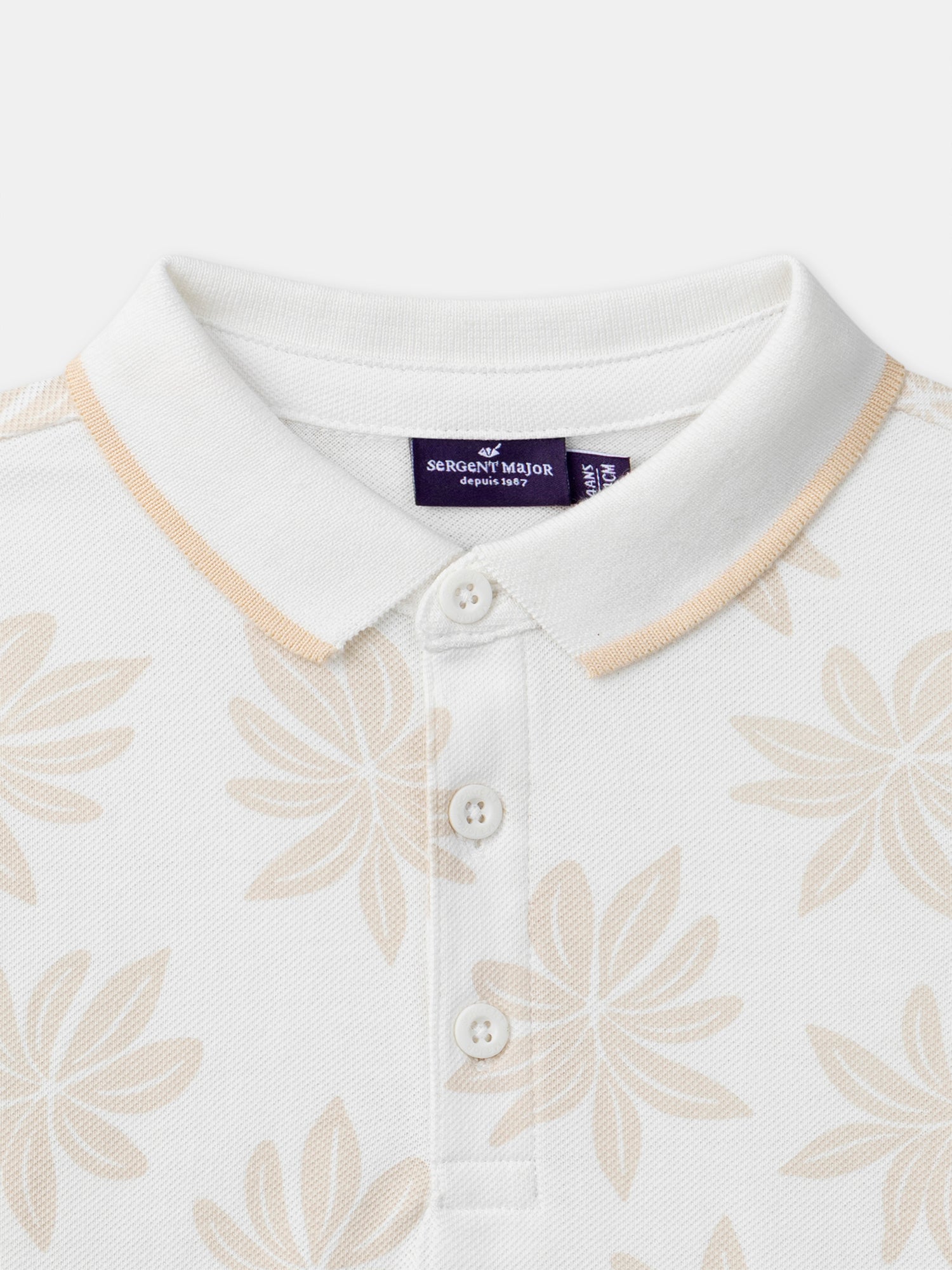 Polo ecru con motivo di palmizi per ragazzi